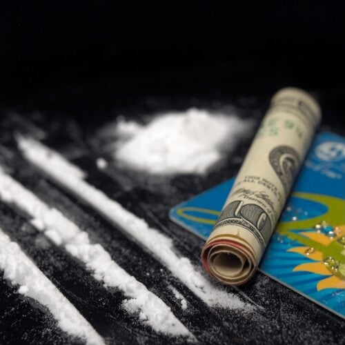 cocaine drug powder over black abuse concept